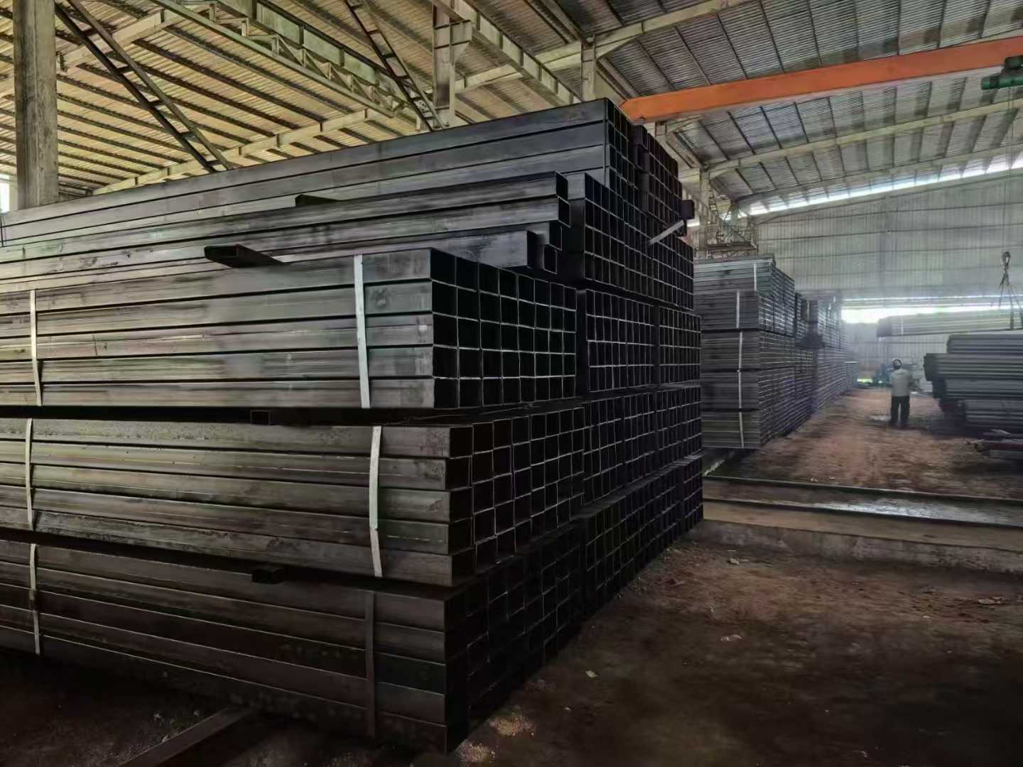 Hollow steel sections stacked inside the warehouse